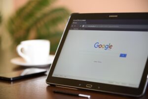Person searching on tablet representing Google Ads visibility issues