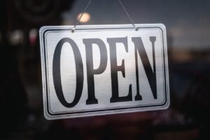 Open sign in a business storefront window